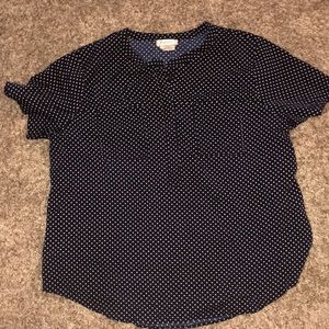 Blue and white polka dot shirt.